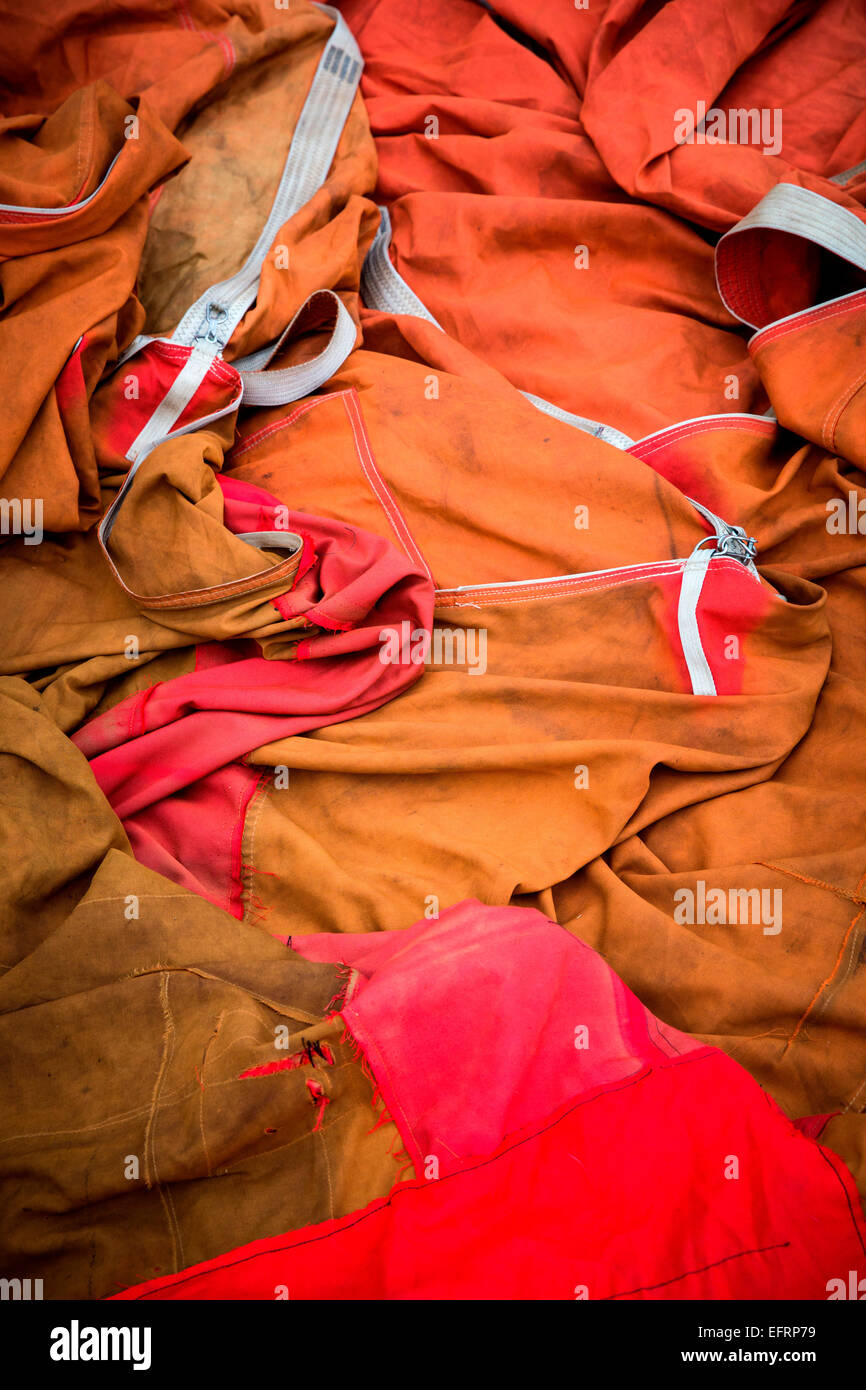 Detail of deflated red and orange hot air balloon envelope Stock Photo