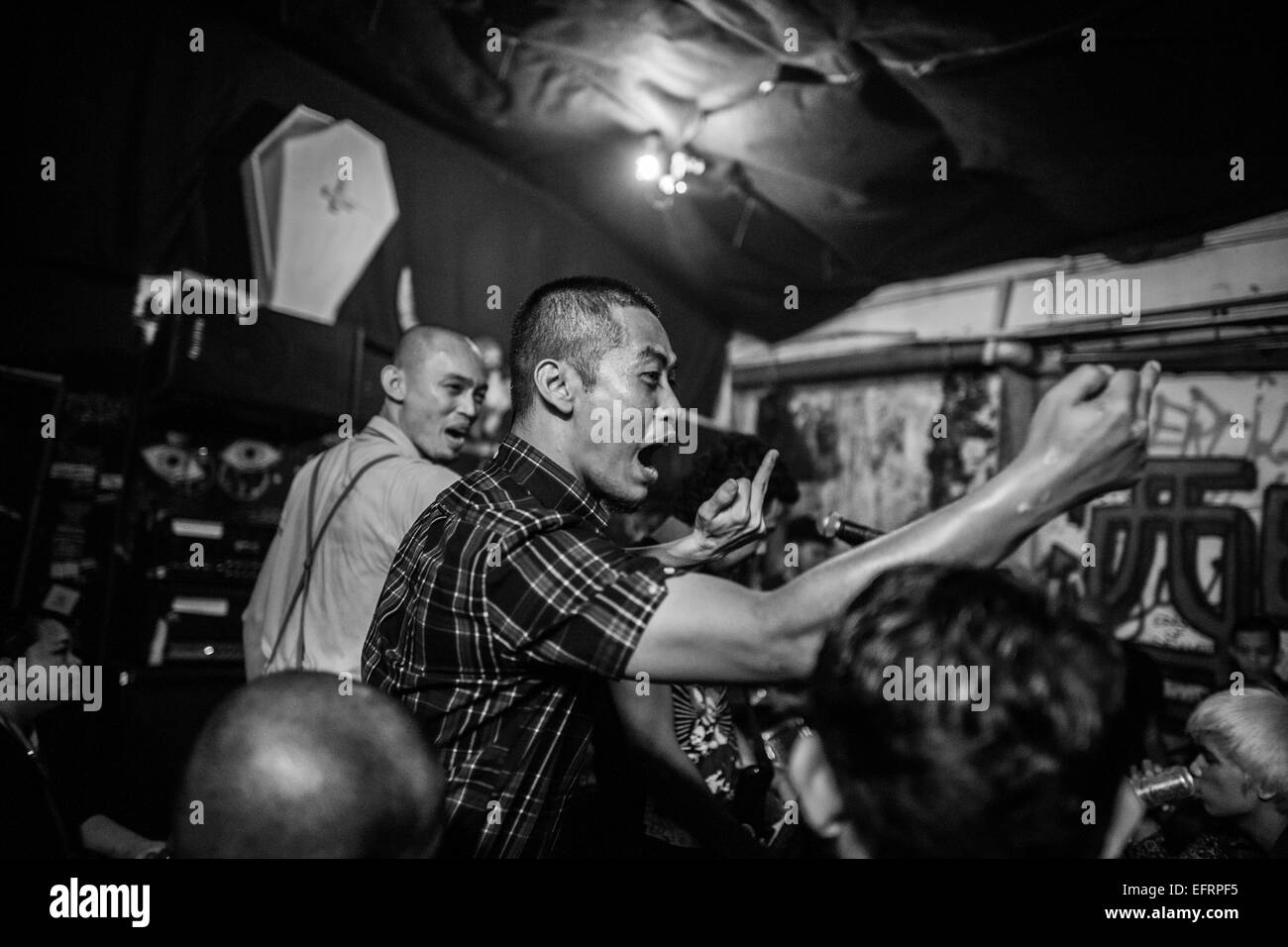 Two black skin heads letting of stream and having fun at a punk gig at the Rumah Api venue in Ampang, Kuala Lumpur. Stock Photo