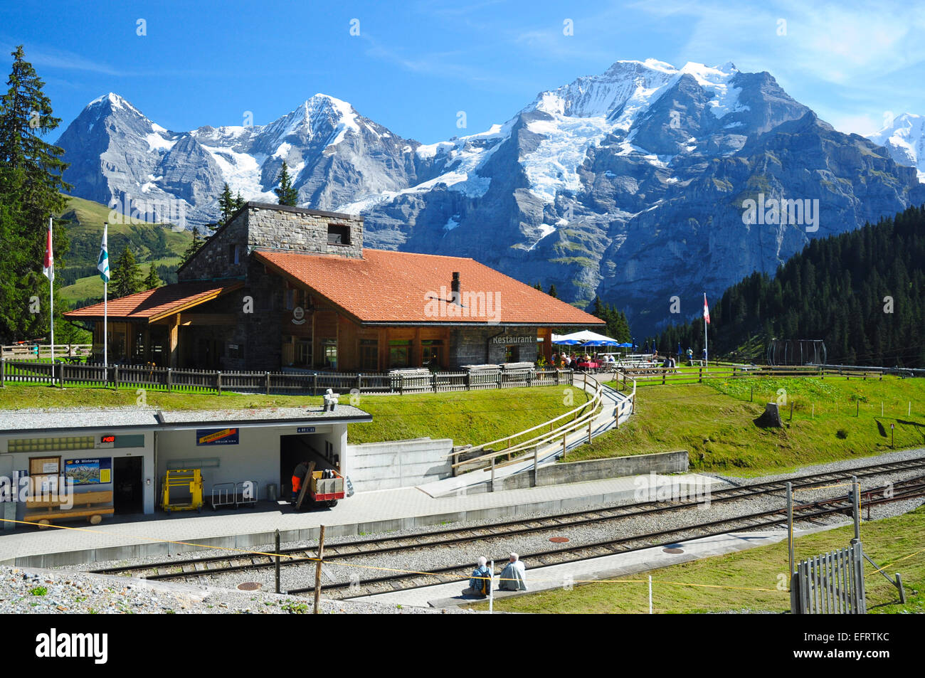 Winteregg railway station on the Grutschalp to Murren railway with the Jungrau and other mountain peaks behind, Switzerland Stock Photo