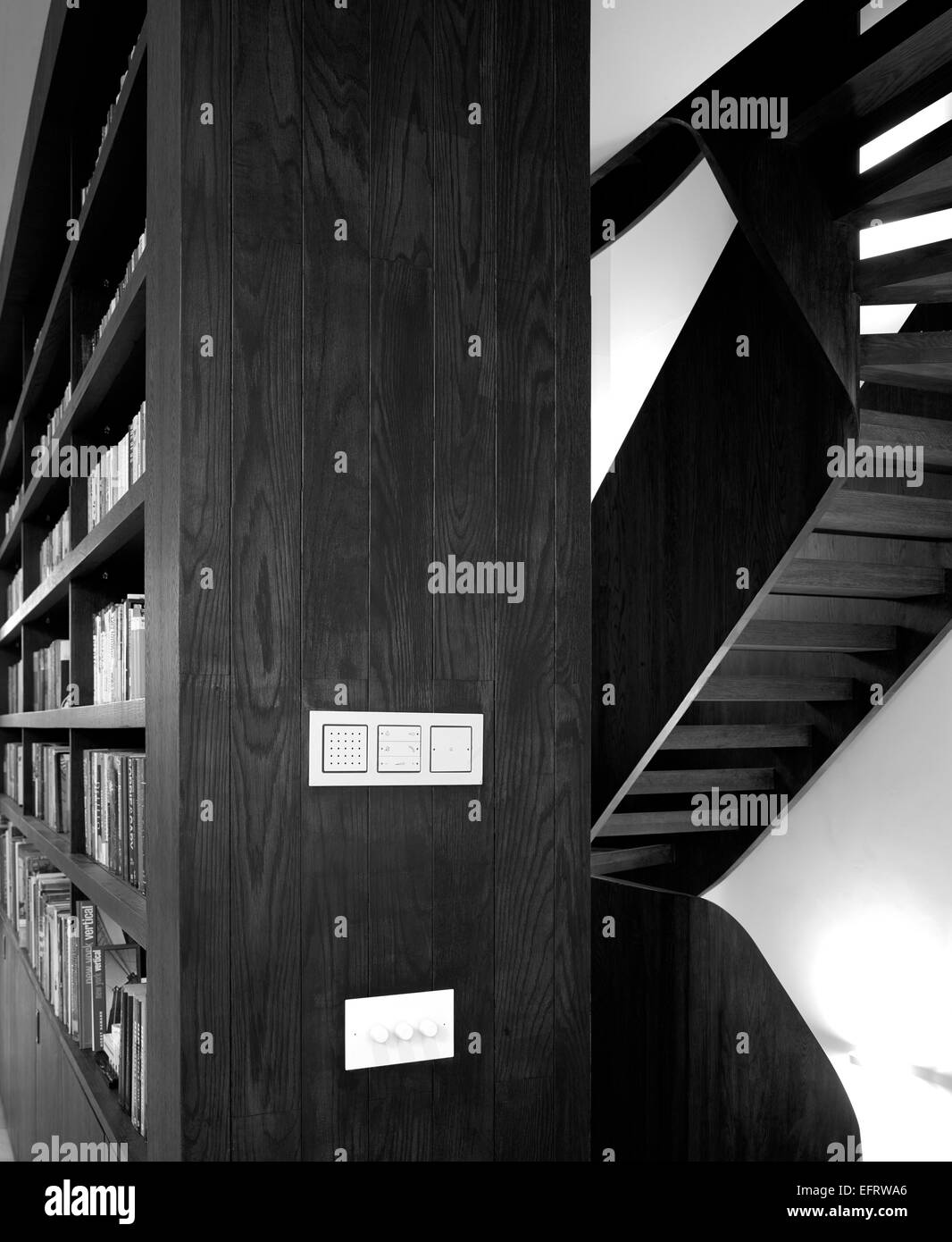 St Johns' Orchard, London, UK. Architect: John Smart Architects, 2013. Black and white interior with bookshelves Stock Photo