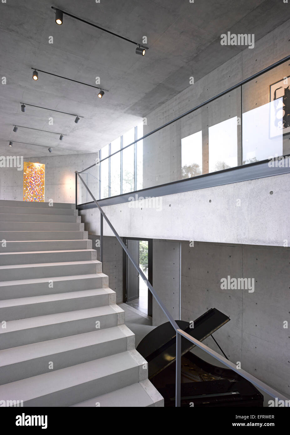 Casa Monterrey, Monterrey, Mexico. Architect: Tadao Ando, 2013. Grand staircase in 'Formal' entrance area with piano. Stock Photo