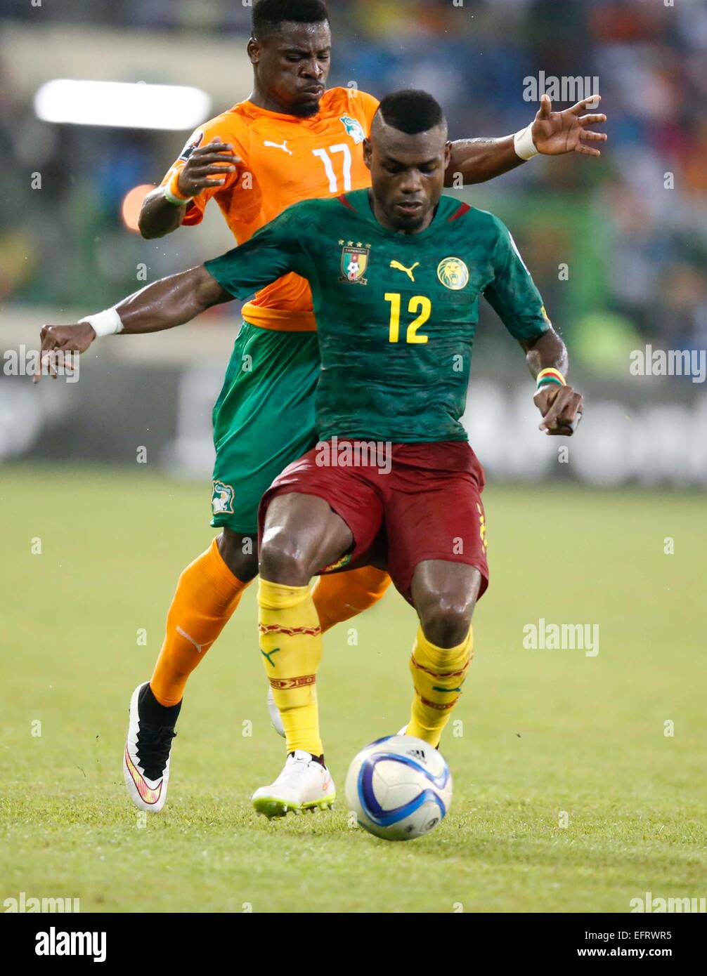 Henri Bedimo of Cameroon shields the ball from Serge Alain Stephane of Cote de Ivoire during their AFCON group D match at Estadio de Malabo in Equatorial Guinea on January 28, 2015. Cote de Ivoire won 1-0. Photo/Mohammed Amin/www.pic-centre.com (Equatoria Stock Photo