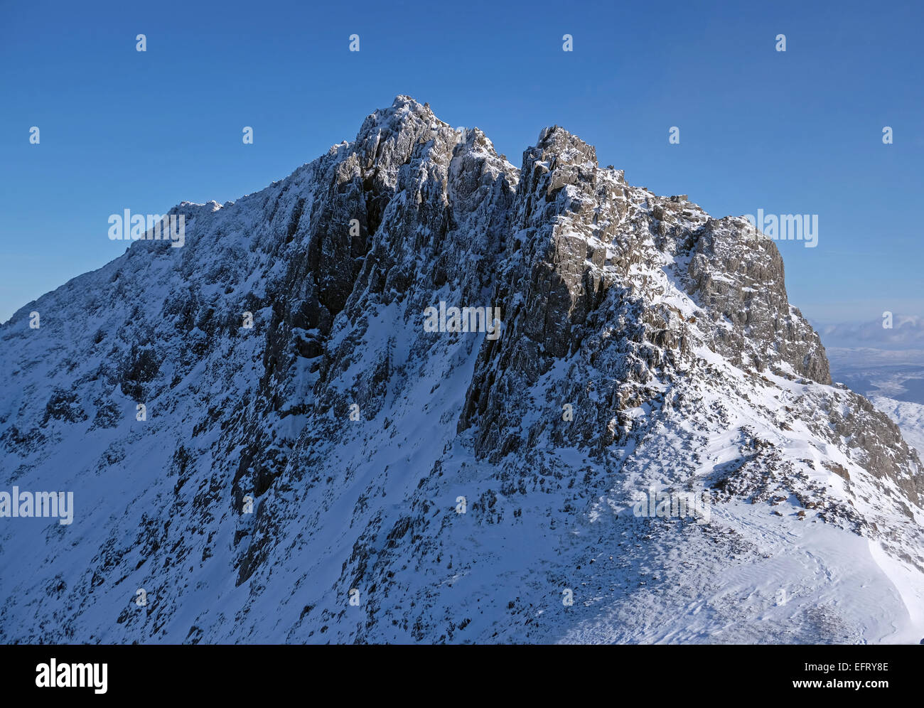Crib Goch in winter conditions, part of the Snowdon horseshoe, is one of the toughest ridges in British mountaineering Stock Photo