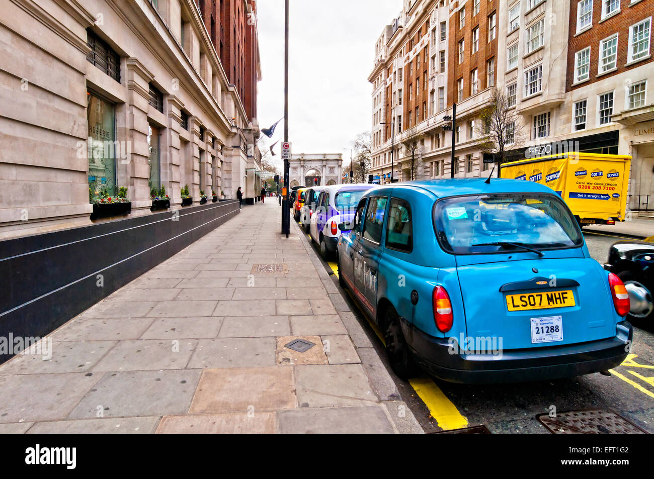 London, UK April 15,2013 row of taxis in front of Marble Arch in London, UK. Motorised