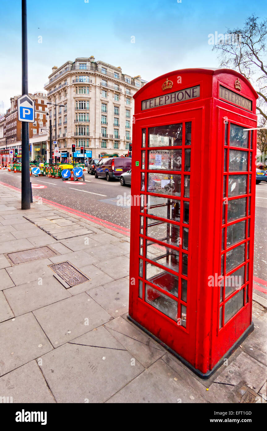 London, UK - April 15, 2013: British icon red phone booth along Oxford Street in London, UK. Oxford Street is Europe's busiest s Stock Photo
