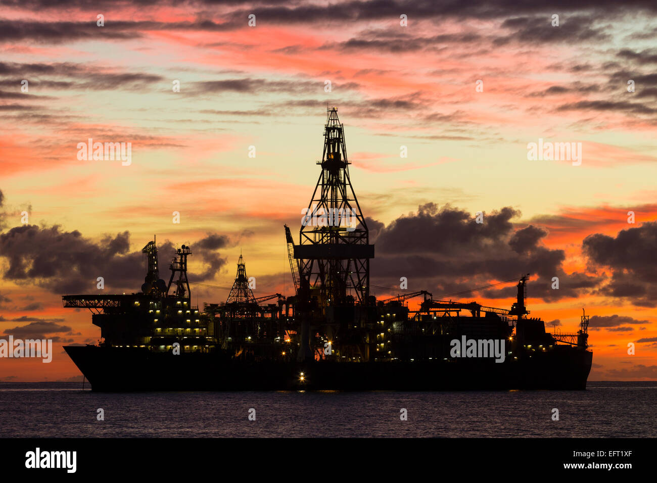 Drill ships/oil rigs at sunrise in Atlantic Ocean Stock Photo Alamy