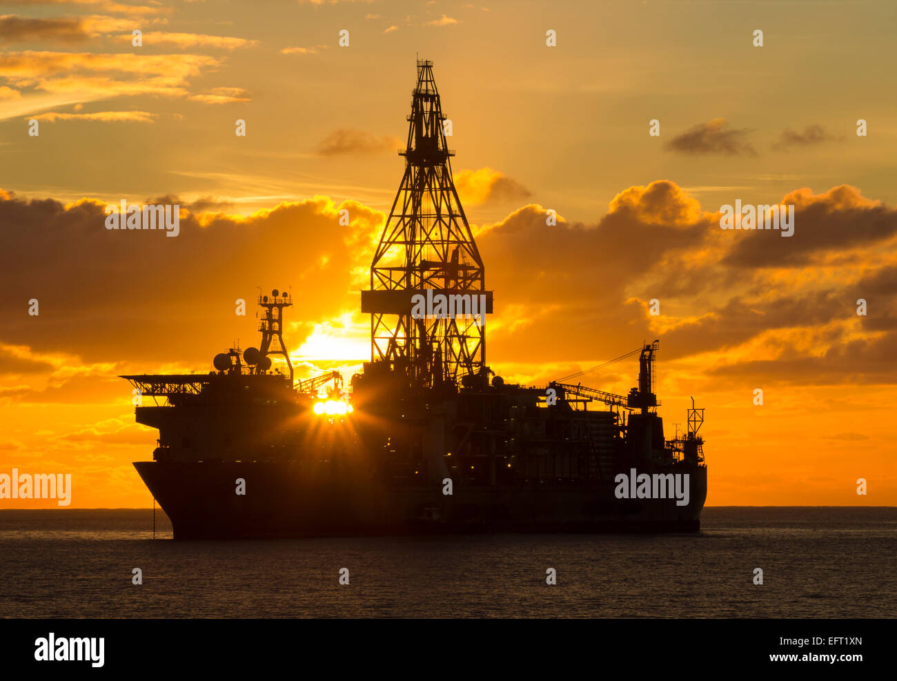 Drill ships/oil rigs at sunrise in Atlantic Ocean Stock Photo Alamy