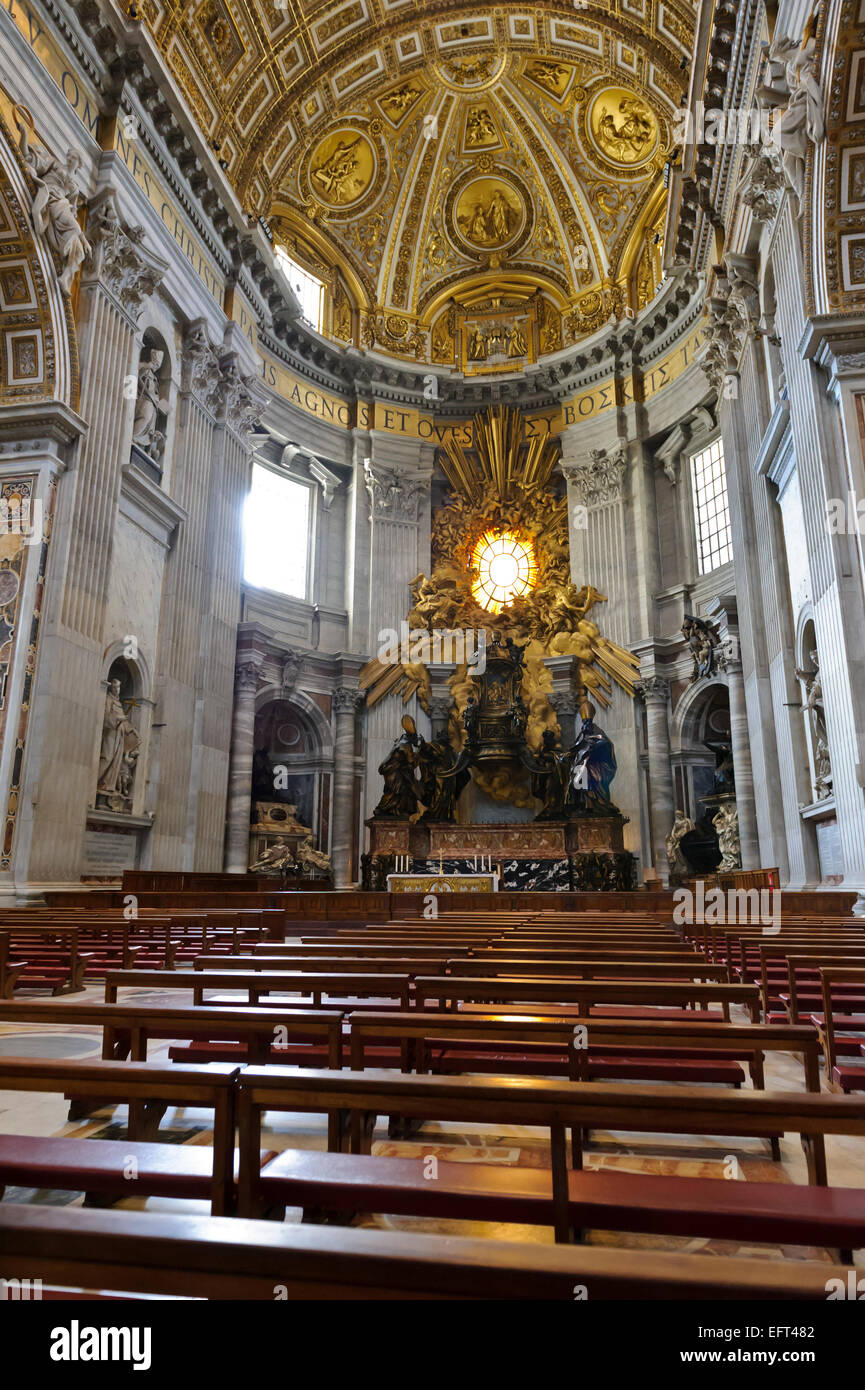 The interior of St Peter's Basilica with a decorative sculpture ...