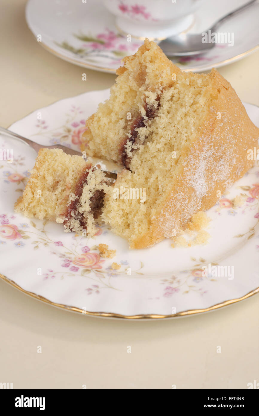 Victoria sponge cake filled with raspberry jam Stock Photo Alamy