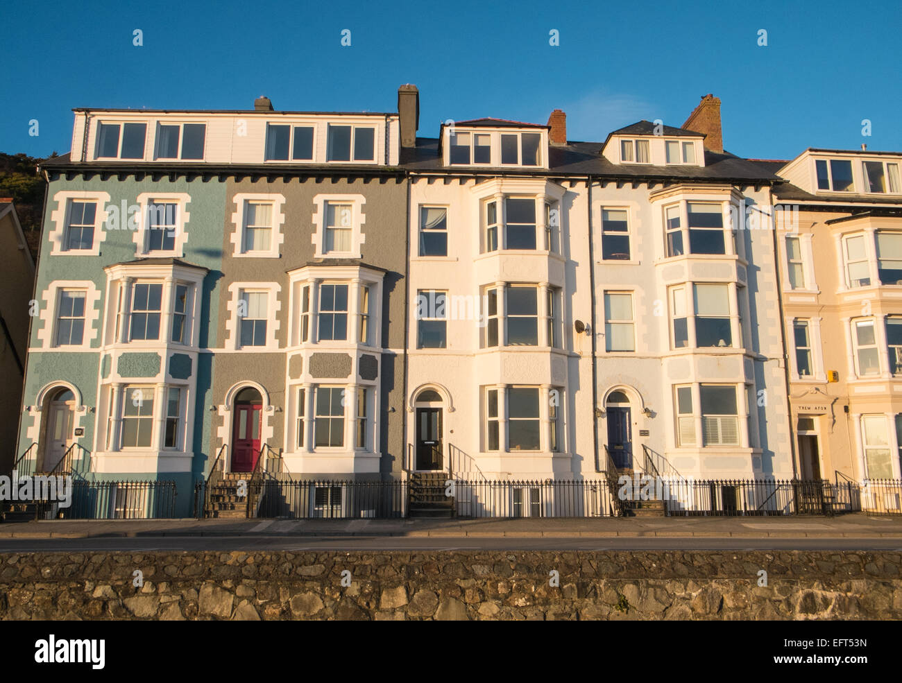 Colourful houses at beach, waterfront at sunset in Aberdyfi / Aberdovey