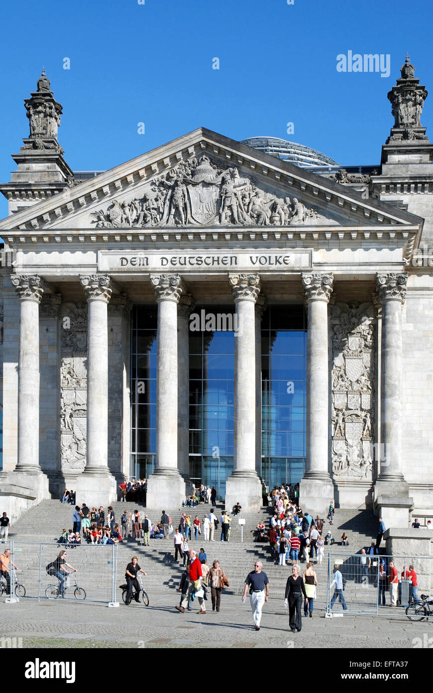 Tourists in front of the Reichstag building in Berlin - Seat of the German Parliament.. Stock Photo