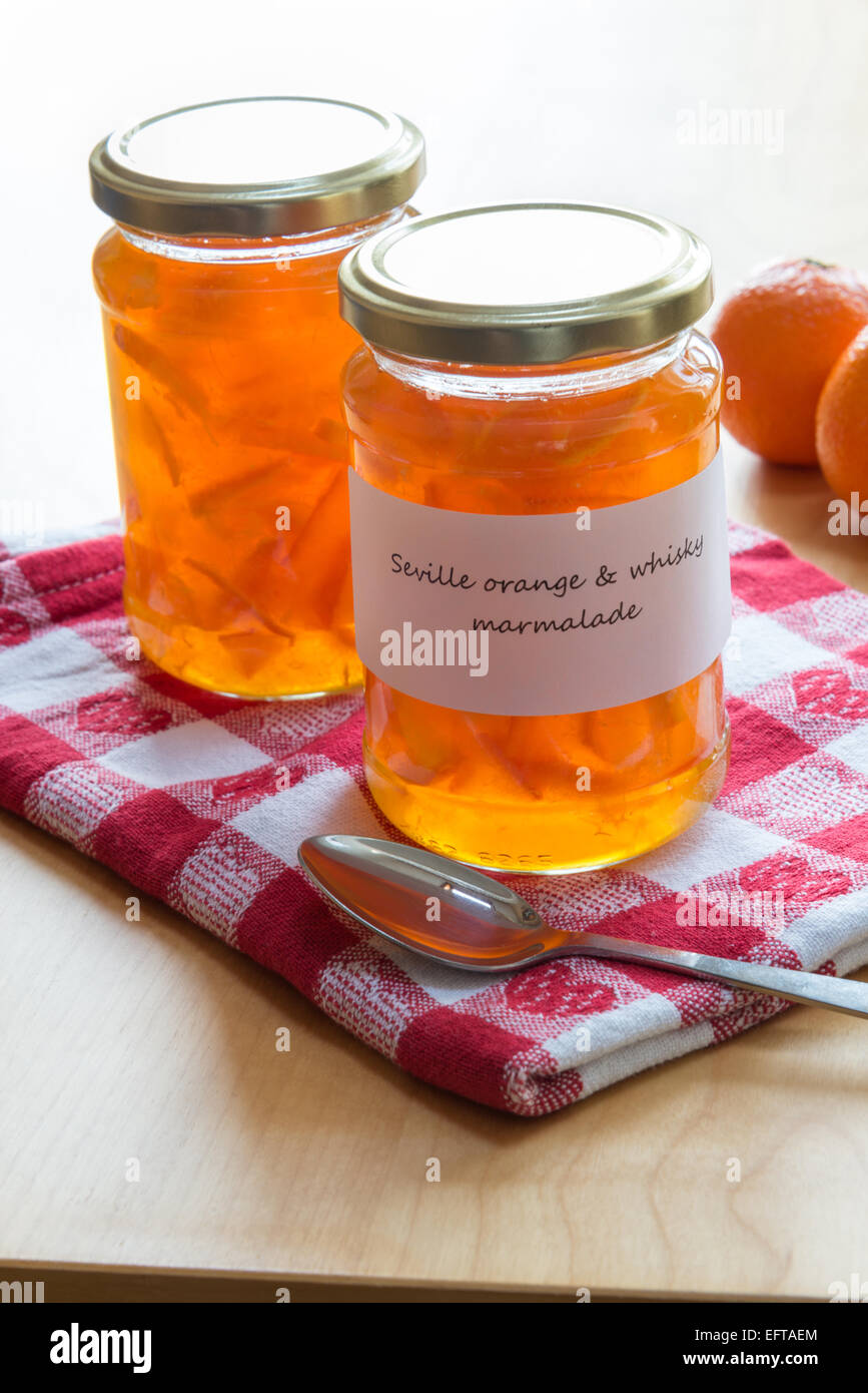 Jars of homemade Seville orange and whisky marmalade. Stock Photo