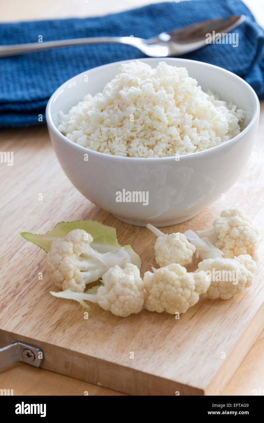 Cauliflower rice - 'rice' made from cauliflower as an alternative to rice. Stock Photo