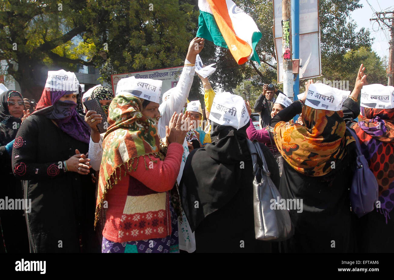 Aam Adami Party (AAP) workers celebrate after AAP won in the Delhi ...