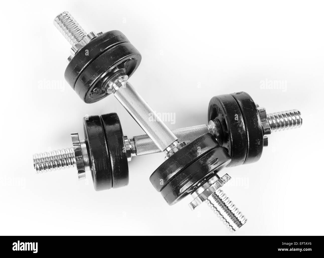 Crossed two hand barbells weights Stock Photo Alamy
