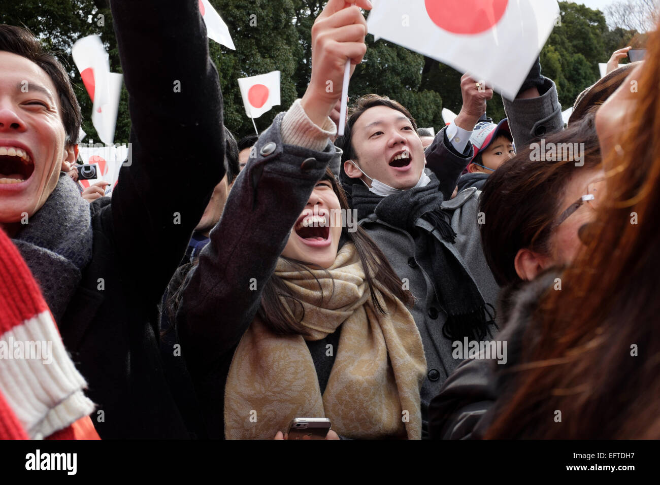 New Year celebrations at the Tokyo Imperial Palace. Crowds gather as the Emperor makes a public appearance. Tokyo, Japan Stock Photo