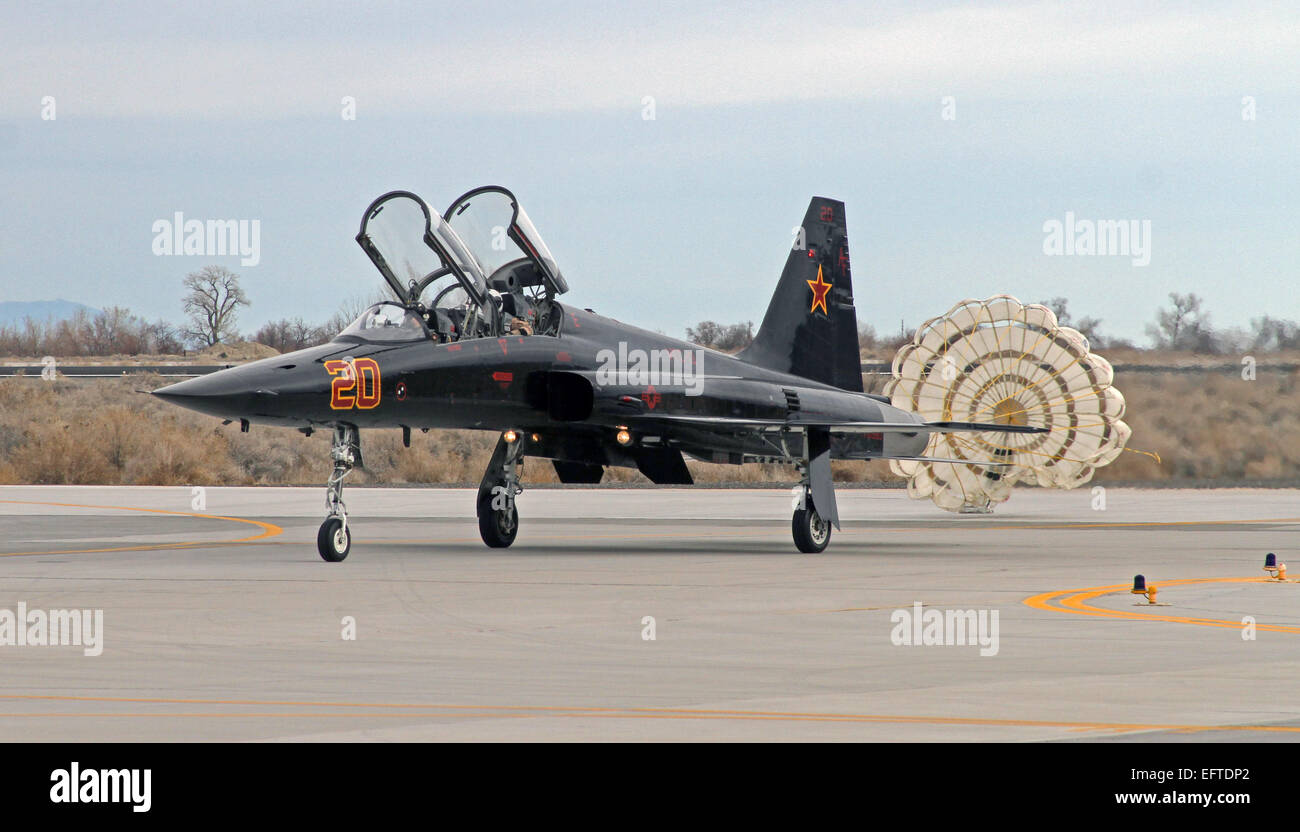 US Air Force F-5 Tiger II fighter aircraft attached to the Saints of Fighter Squadron Composite 13 taxis after deploying a drag parachute upon landing at Naval Air Station Fallon February 5, 2015 in Fallon, Nevada. Stock Photo