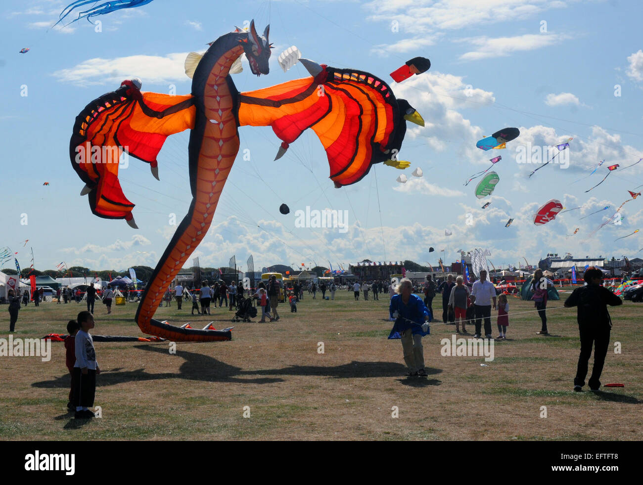 A dragon looks menacing as it frlies over the seafront at Southsea, Hants at the annual Kite Festival. Pic Mike Walker, Mike Wal Stock Photo