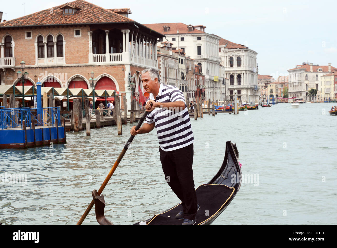 Gondolas transport tourists up and down the Grand Canal, Venice Italy. Stock Photo