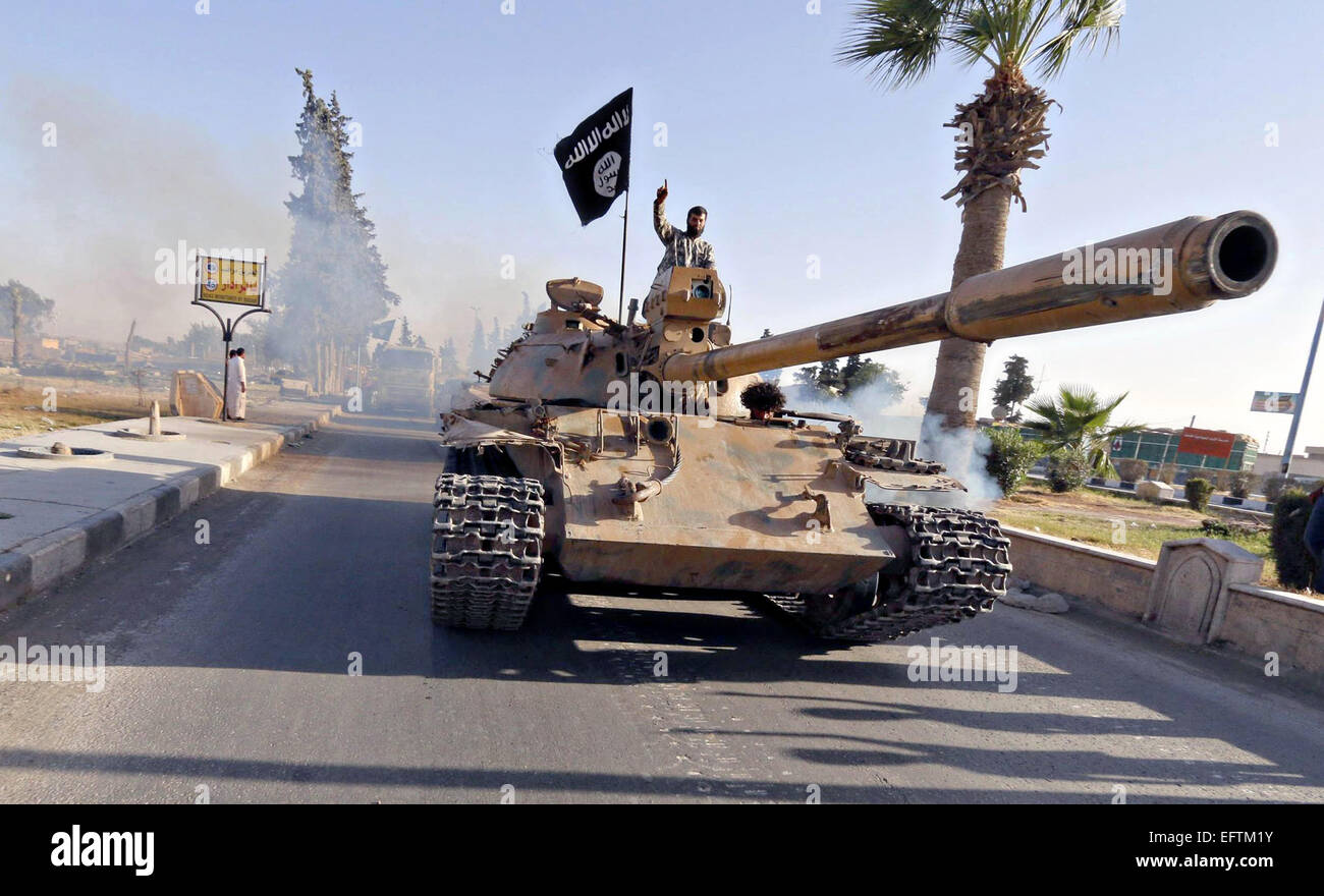 Islamic State of Iraq and the Levant fighters during a military parade in Raqqa province in Syria June 30, 2014 shown in propaganda photos released by the militants. Stock Photo