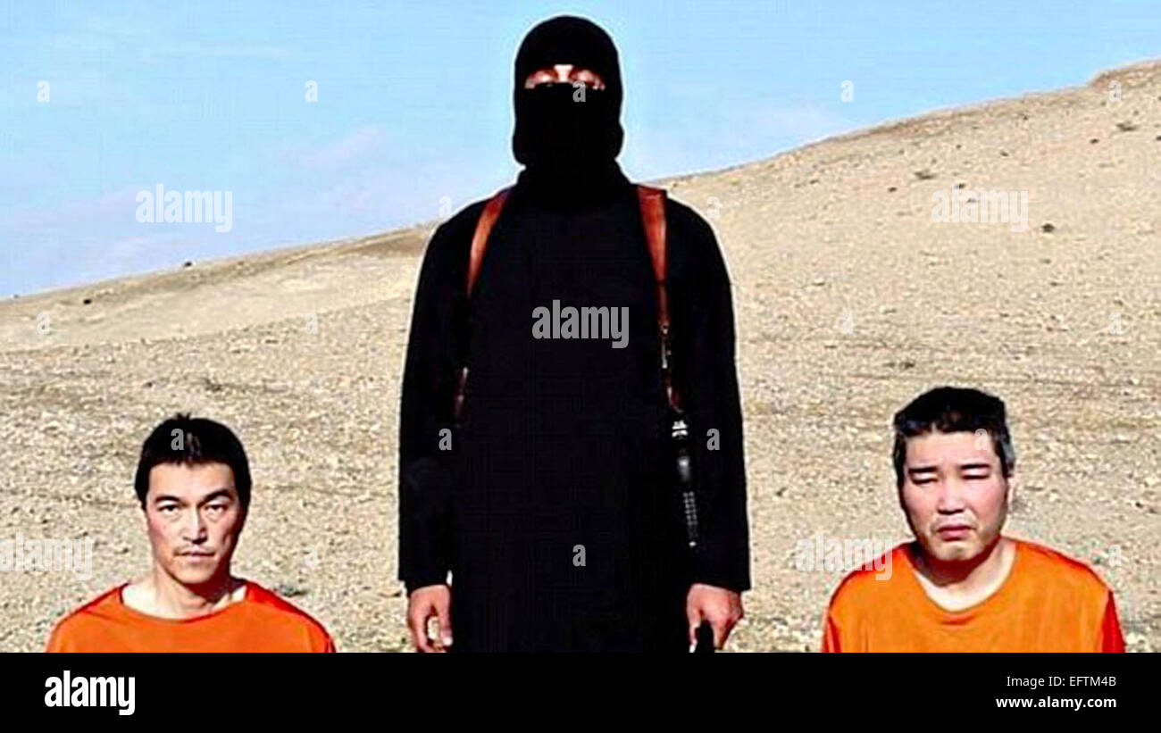 Islamic State of Iraq and the Levant fighter threatens to behead Japanese hostages Journalist Kenji Goto Jogo, left, and military contractor Haruna Yukawa in a propaganda video released by the organization January 20, 2015. Stock Photo