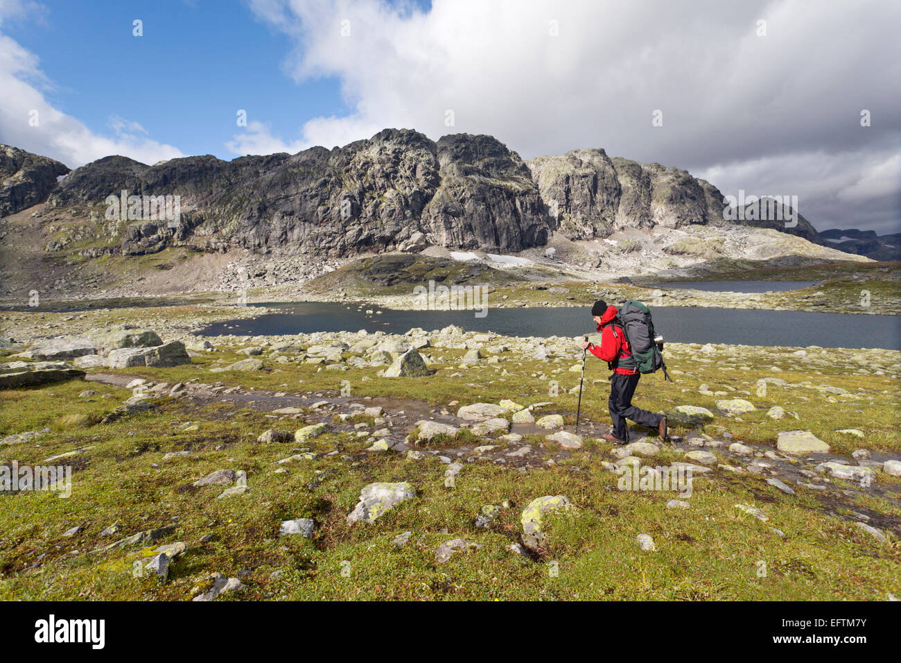Woman backpacking in the Hardangervidda wilderness, Norway Stock Photo