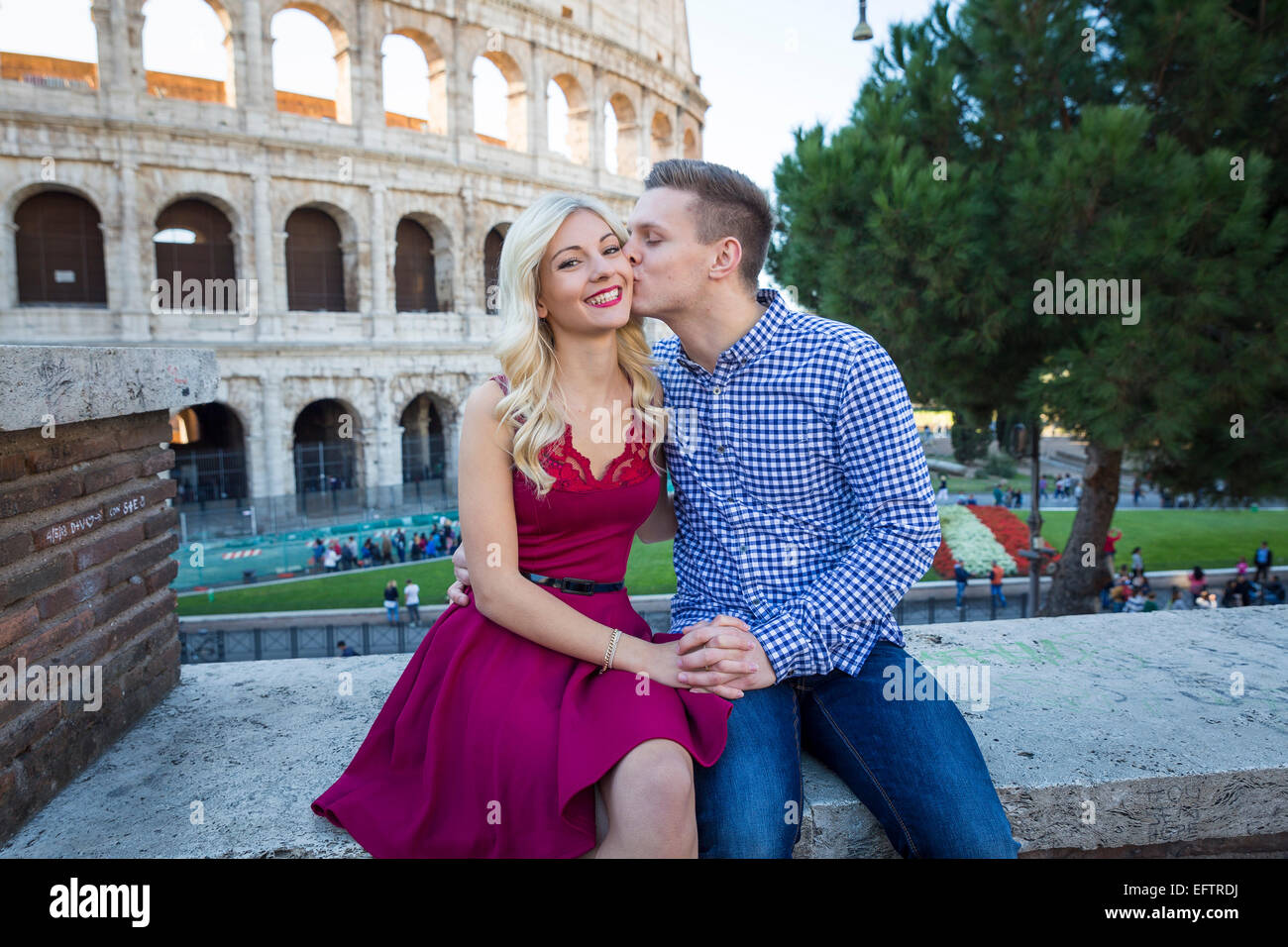 Couple kissing at the Roman Colosseum in Rome Italy. Stock Photo