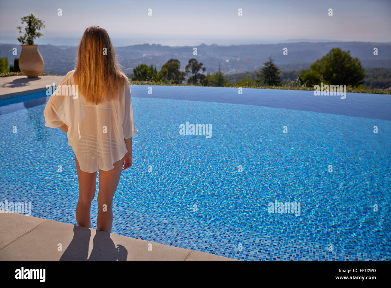 Young woman by the pool on holiday in the South of France Stock Photo