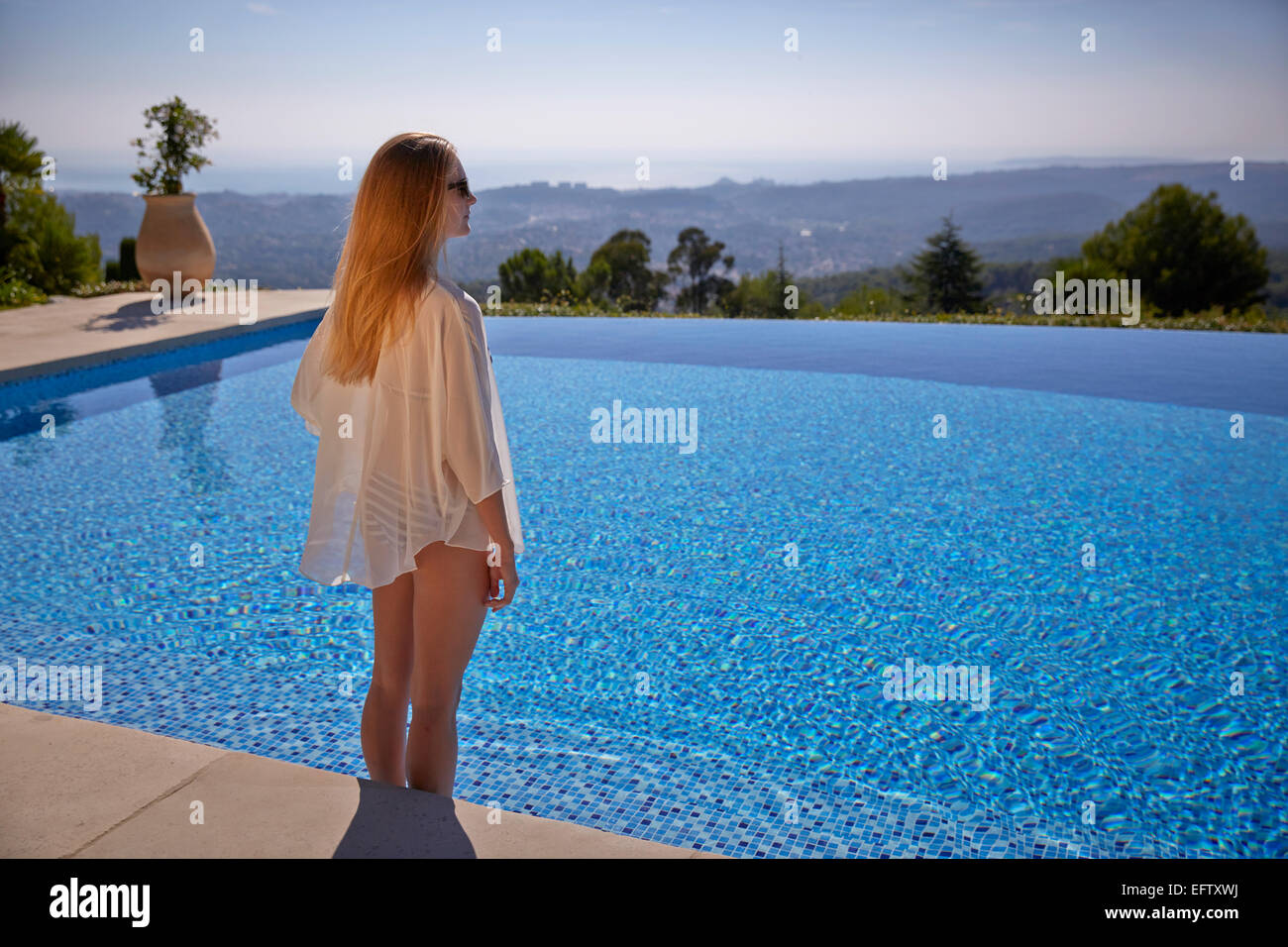 Young woman by the pool on holiday in the South of France Stock Photo