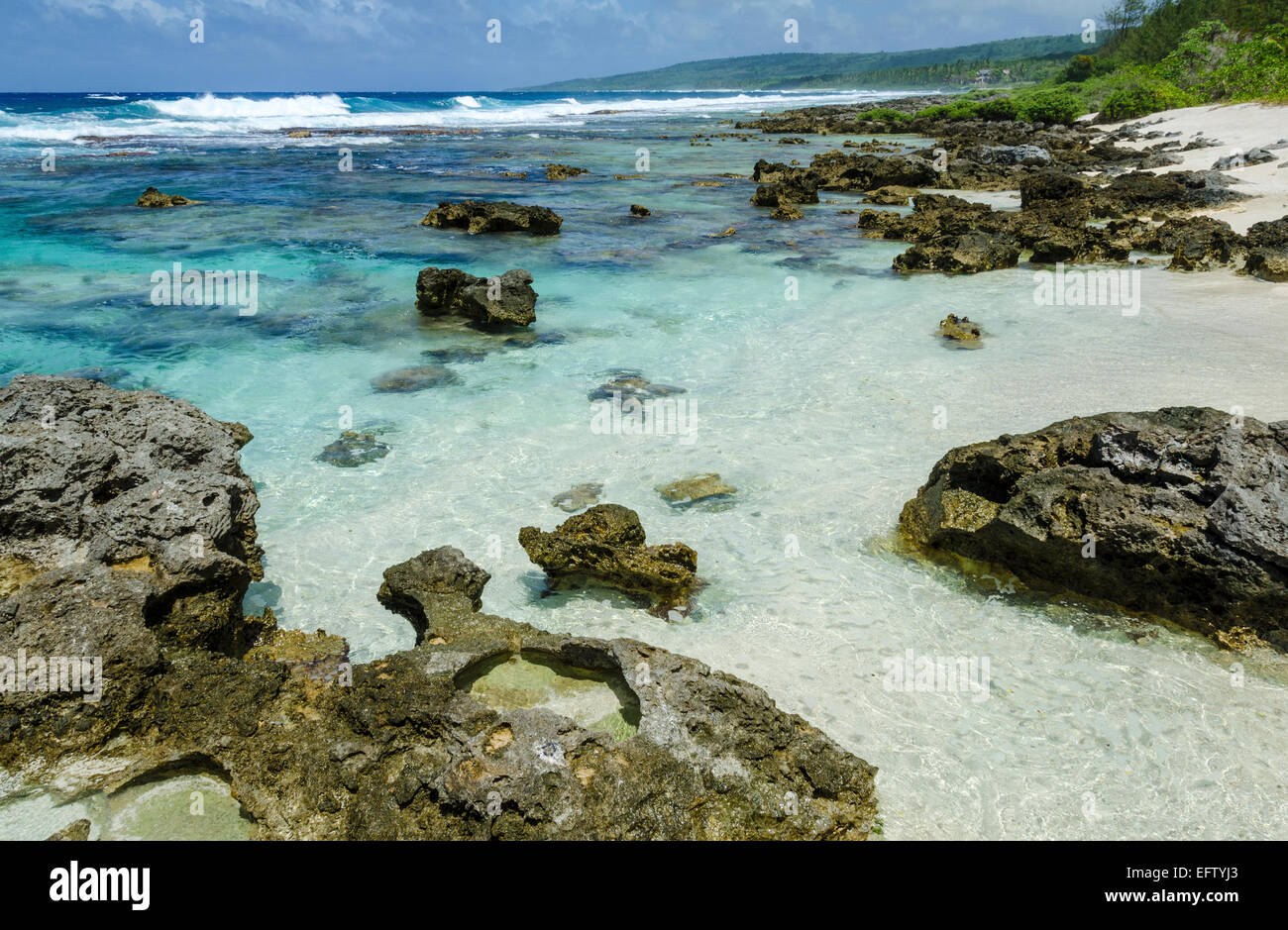 Reef protected beach on tropical island. Stock Photo