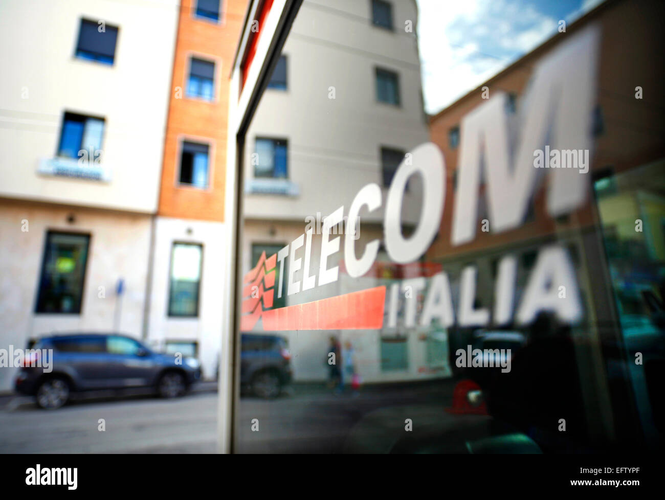 Reflections in a phone kiosk operated by Telecom Italia in Chieti, Italy. Stock Photo