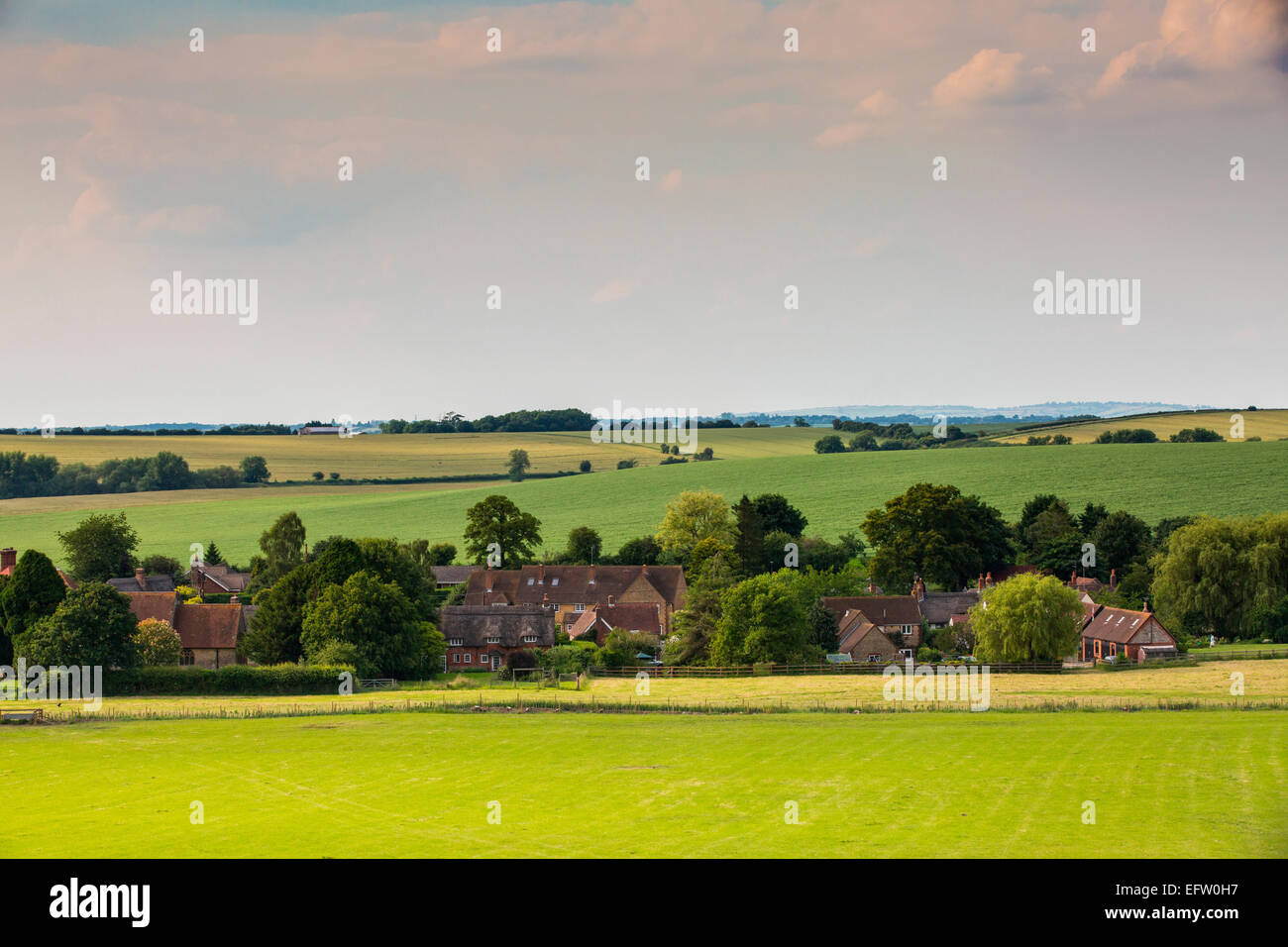 Distant view of traditional village in rural landscape, Oxfordshire, England Stock Photo