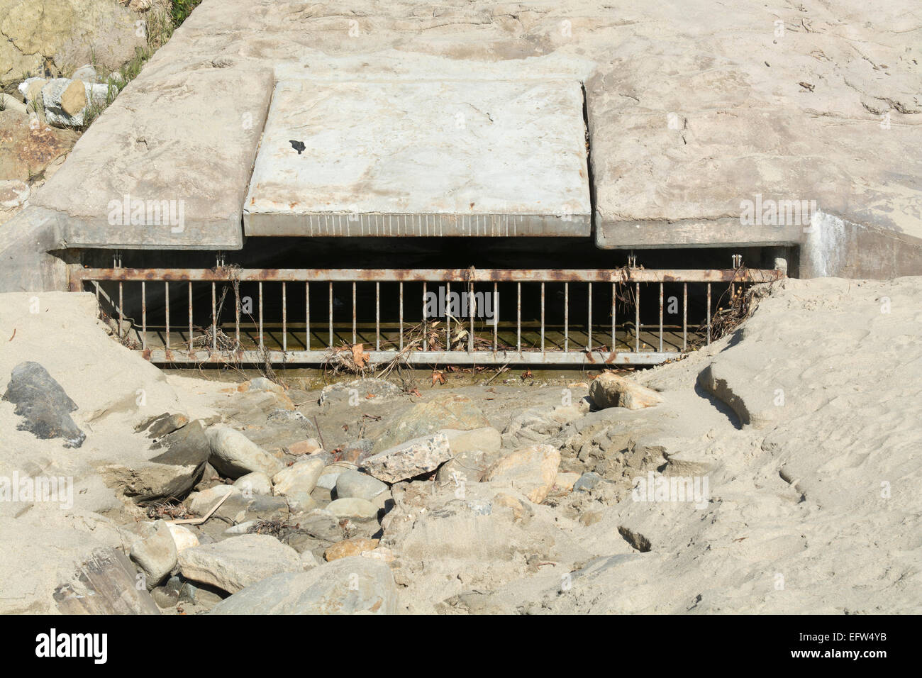 A beach sewer used to drain water runoff from the cliff side during heavy rains to control flooding Stock Photo