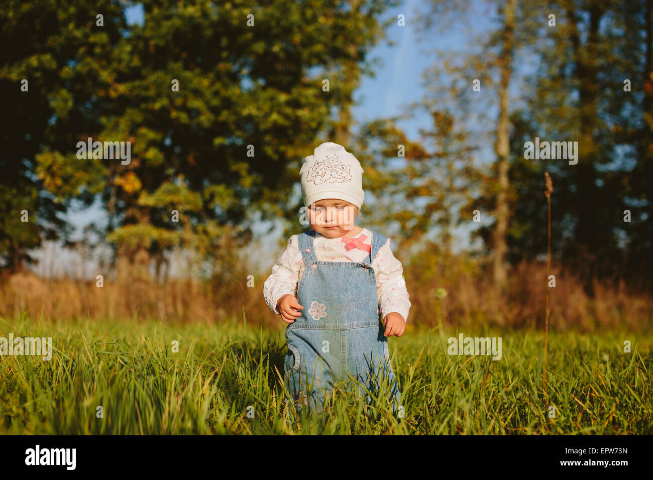 child walks on the grass Stock Photo Alamy