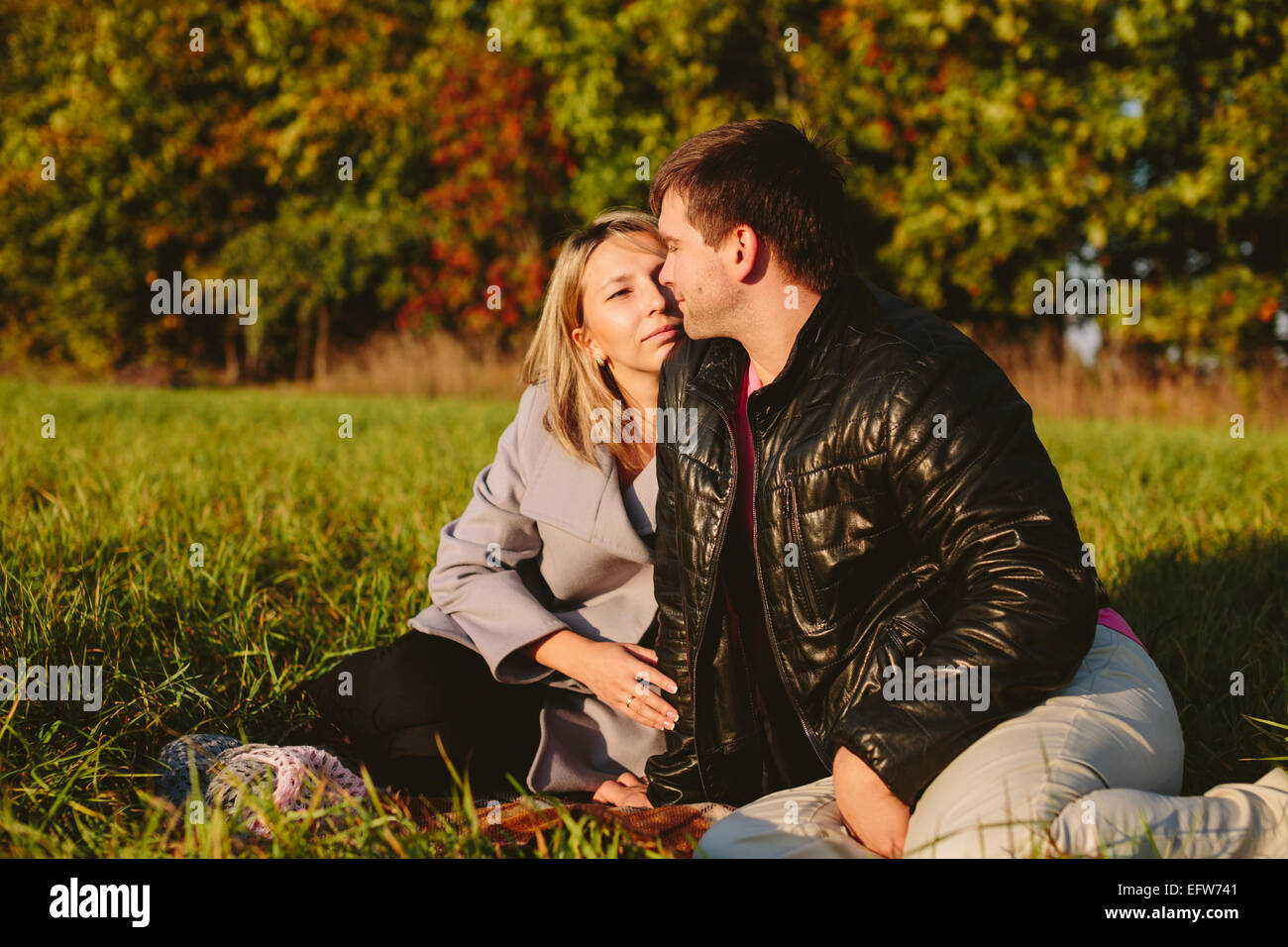 beautiful young couple in the park Stock Photo