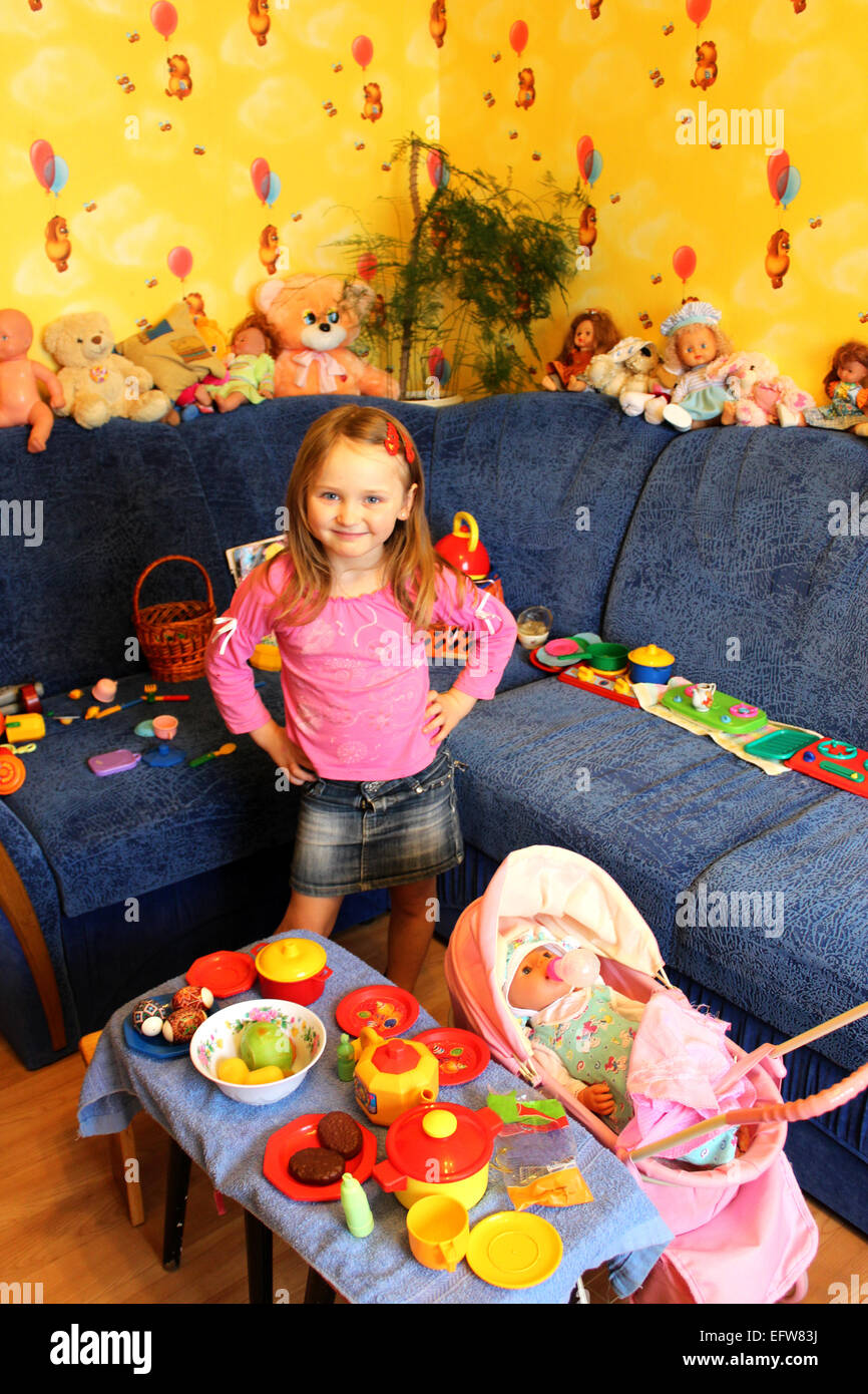 little girl playing with toys in her room Stock Photo - Alamy