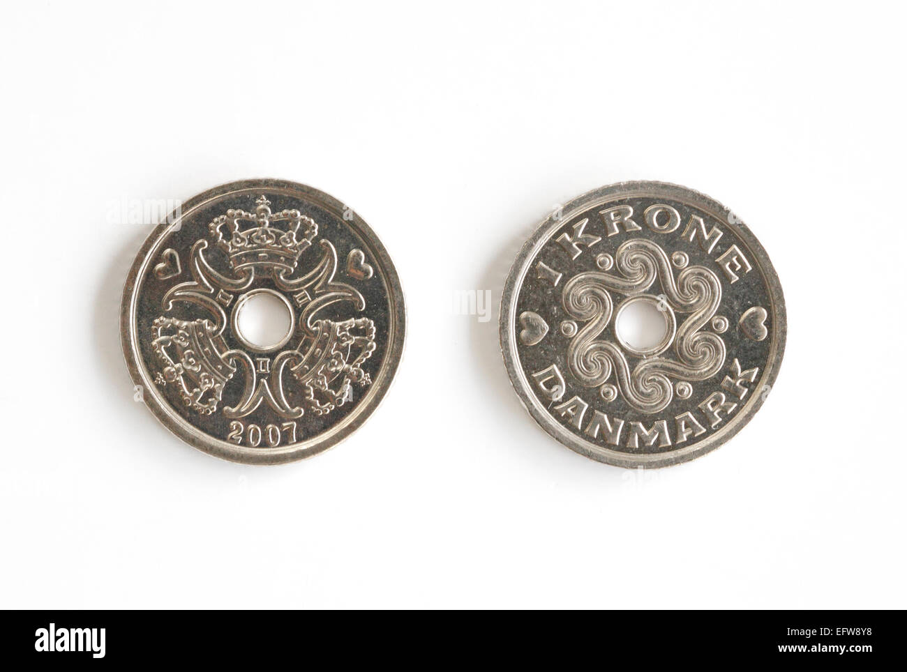 Two Danish one Kroner pieces on a white background Stock Photo