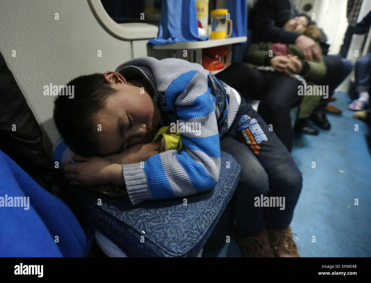 Shanghai, China's Sichuan Province. 9th Sep, 2015. A child sleeps on a chair on train 3663, which runs from east China's Shanghai to Chengdu, capital of southwest China's Sichuan Province, on Sept. 9, 2015. The Spring Festival, or the Chinese lunar New Year which starts from Feb. 19 this year, is known as the world's biggest migration, with millions of people traveling vast distances for family reunions. © Ding Ting/Xinhua/Alamy Live News Stock Photo