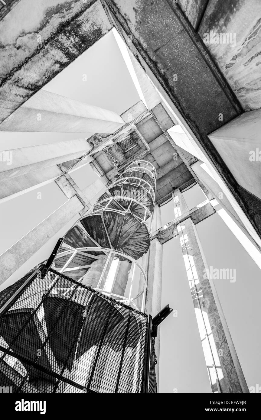 looking up at spiral staircase insode clock tower, Victoria, BC, Canada Stock Photo