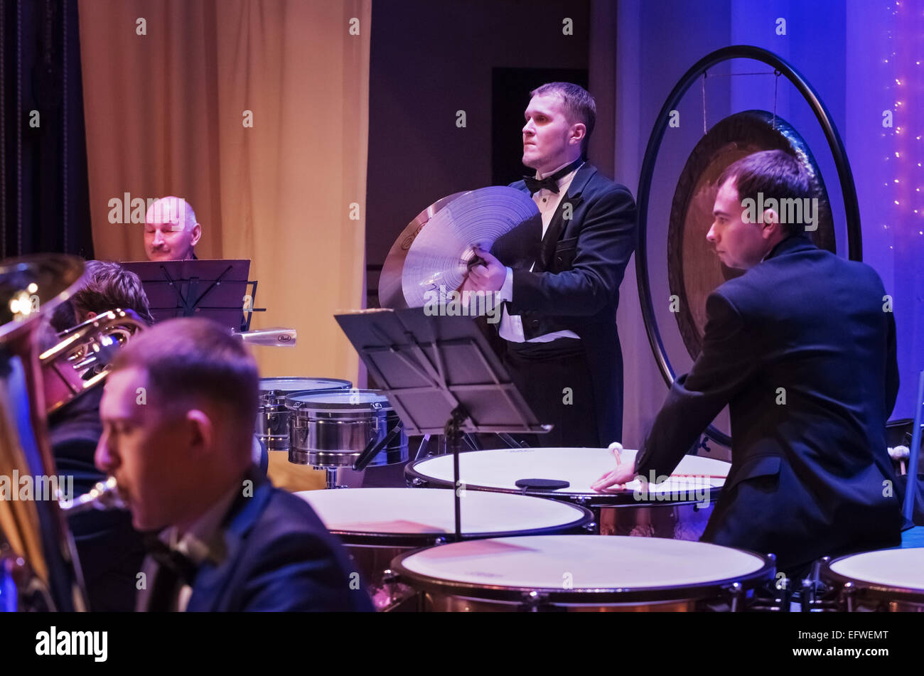 The musicians near the musical instruments during a concert Stock Photo