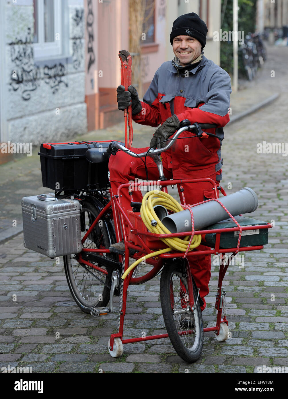bremen-germany-21st-jan-2015-plumber-theodor-roehm-rides-with-his-EFWF3M.jpg