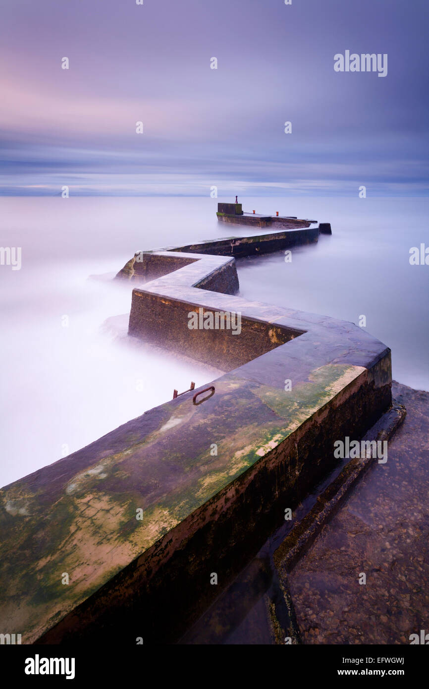 The breakwater at the old picturesque fishing village St Monans on the East Neuk coast in Fife. Stock Photo