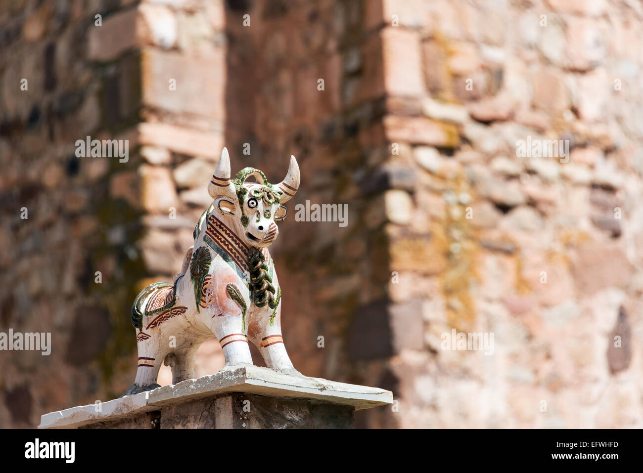 Small bull figurine on a church in Pucara, Peru near Cusco.  The bull is believed to protect buildings. Stock Photo