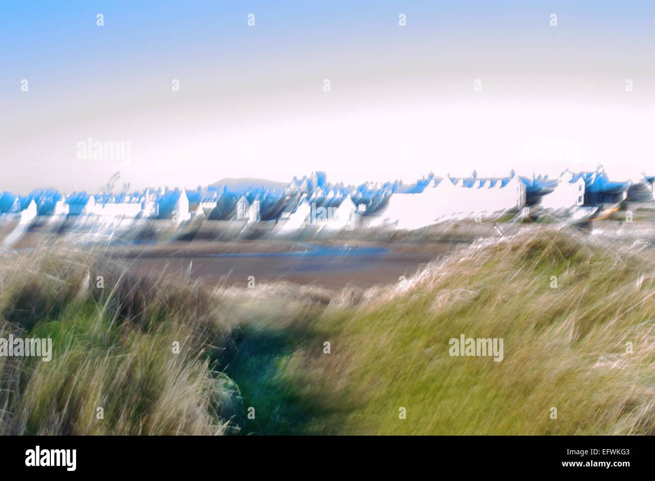 Elie beach at low tide with village through the sand dunes, Elie, East