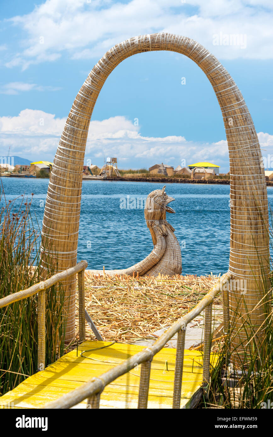 Arch and reed boat at Uros floating islands near Puno, Peru Stock Photo