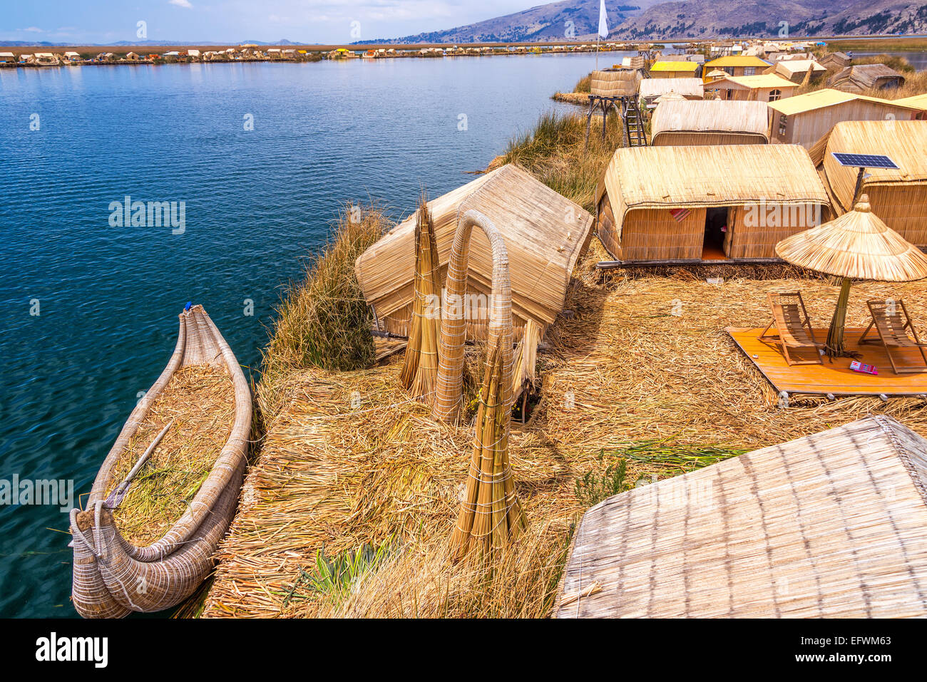 Manmade Uros floating islands and reed boat boat near Puno, Peru on Lake Titicaca Stock Photo