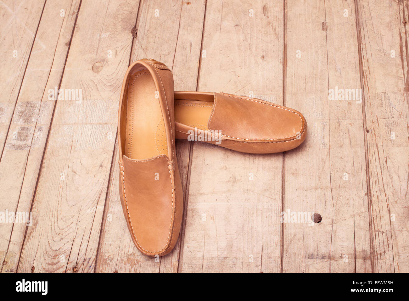 Men's Loafer Shoe on old wood background Stock Photo