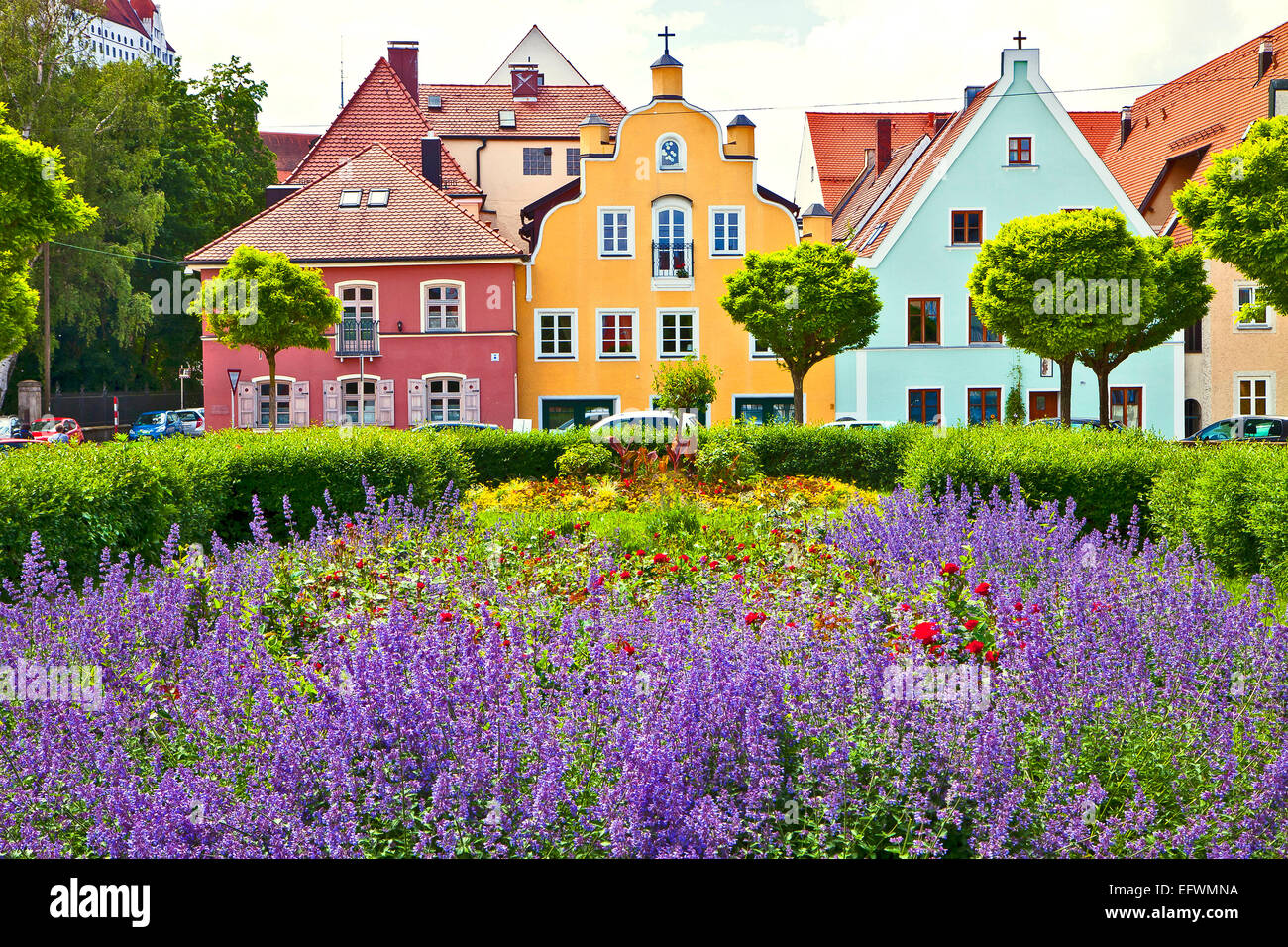 Springtime in Landshut, Bavarian city near Munich. Wonderful purple sage flowerbed in front of typical Renaissance houses Stock Photo