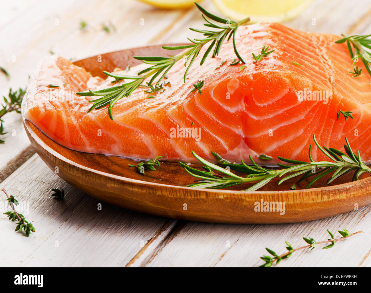 Salmon fillet on wooden background. Selective focus Stock Photo