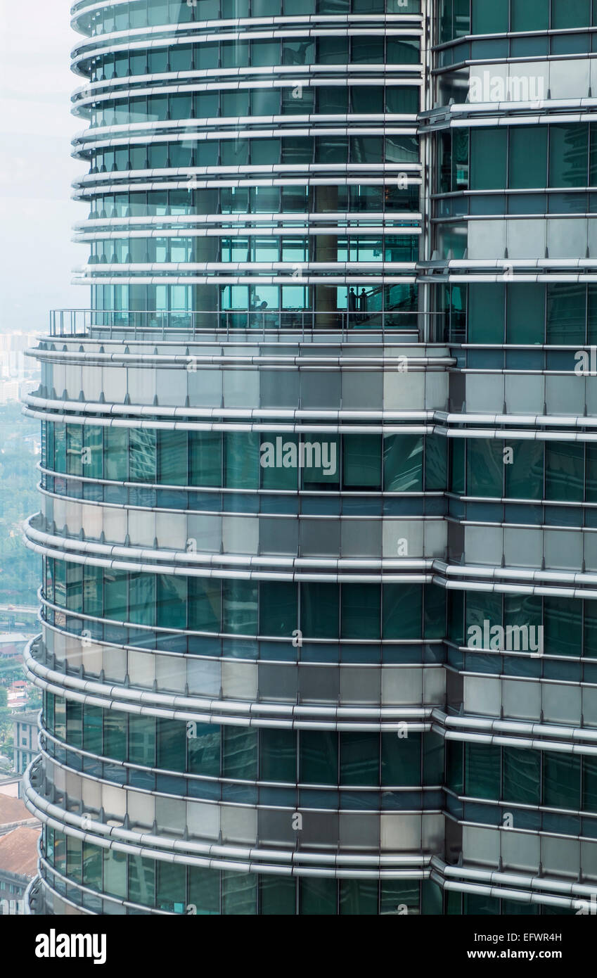 View through the window from the bridge level on the Petronas towrs building in Kuala Lumpur, Malaysia. Stock Photo